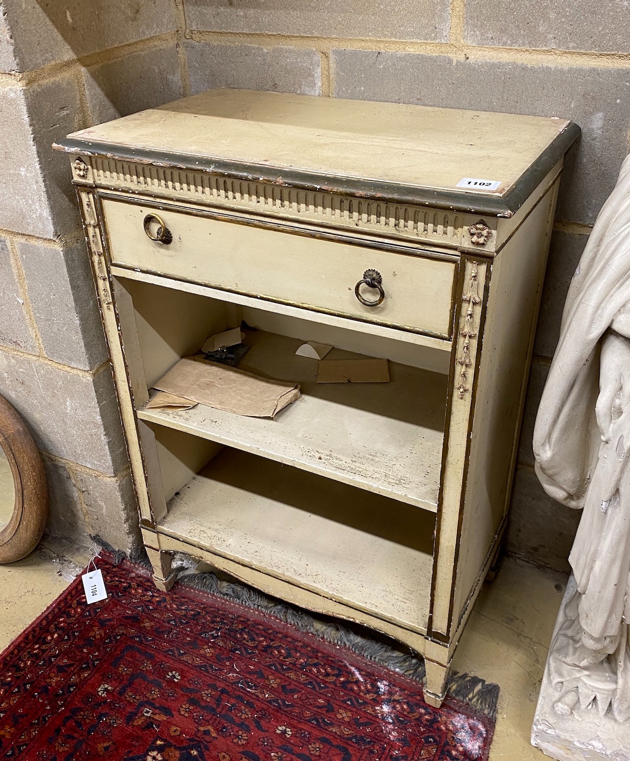 An Adam style cream painted and gilt open bookcase, width 60cm, height 84cm